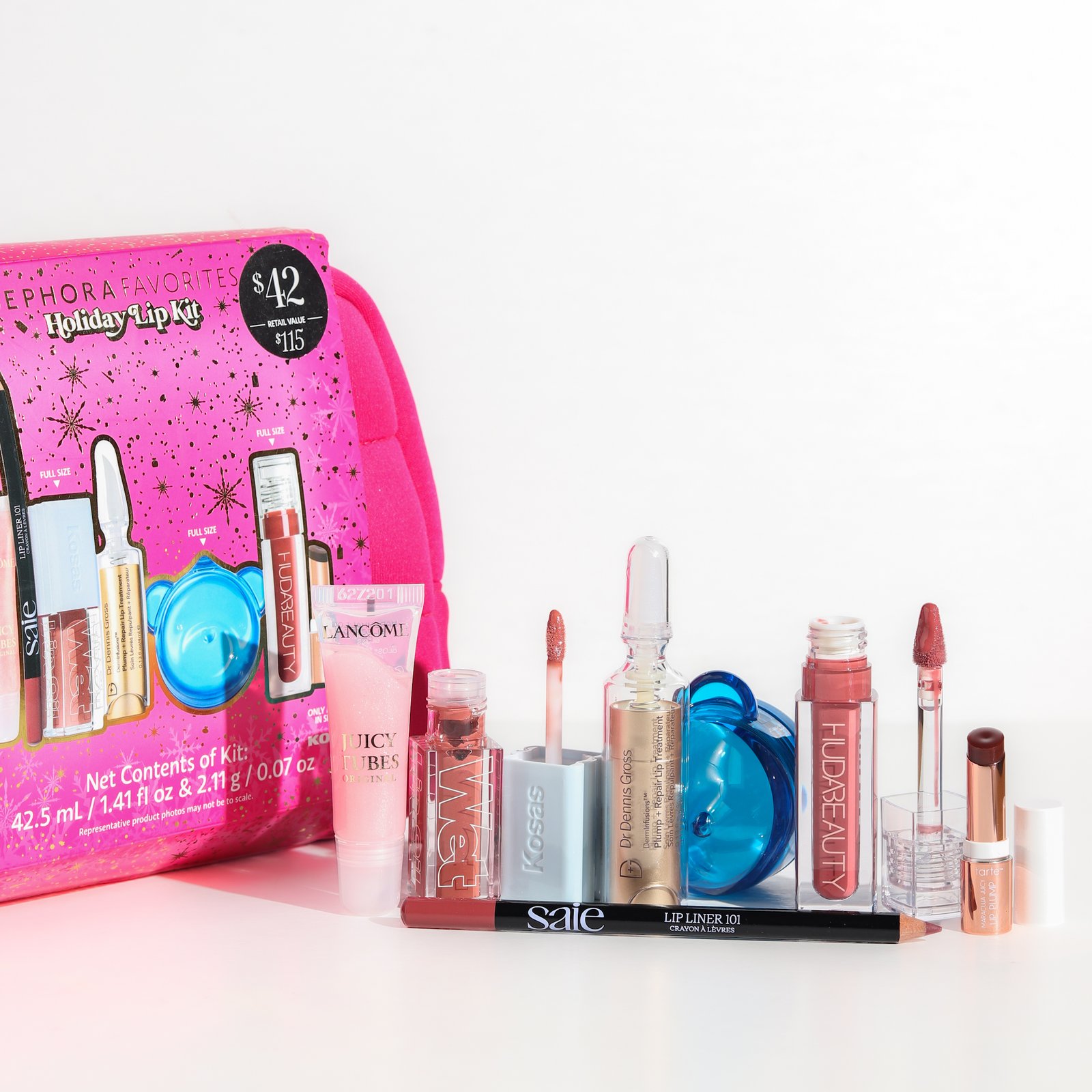 Holiday Lip Kit Kosas Wet Lip Oil Plumping Peptide Lip Treatment Gloss Unbuttoned (full size)4.6ml Saie Lip Liner 101: Creamy & Nourishing Lip Pencil Twist full size 1.14g Huda Beauty Faux Filler Shiny Non-Sticky Lip Gloss Bombshell Full size 3.9ml Tarte Maracuja Juicy Lip Plumping Gloss Honeysuckle 1.41g Dr. Dennis Gross Skincare DermInfusions Plump + Repair Lip Treatment With Hyaluronic Acid 4ml Dr. Jart+ Vital Hydra Solution Jelly Bear Lip Mask with Hyaluronic Acid Full size 20ml Lancome Juicy Tubes Original Lip Gloss Marshmallow Electro 1.41ml